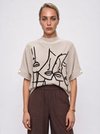 ABSTRACT FACE PRINT DOLMAN KNIT