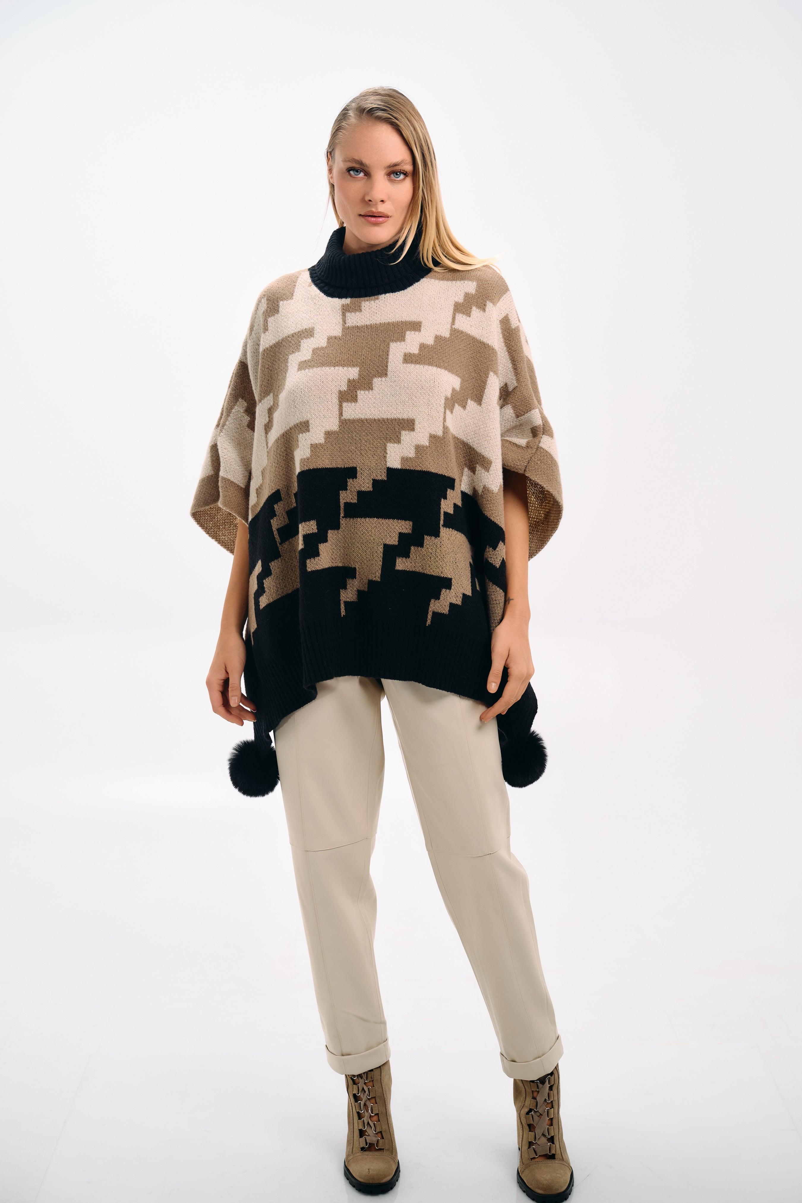 PATTERNED KNIT CAPE WITH POMPONS