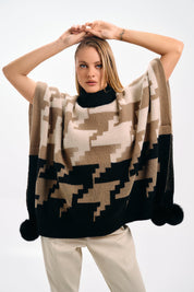 PATTERNED KNIT CAPE WITH POMPONS