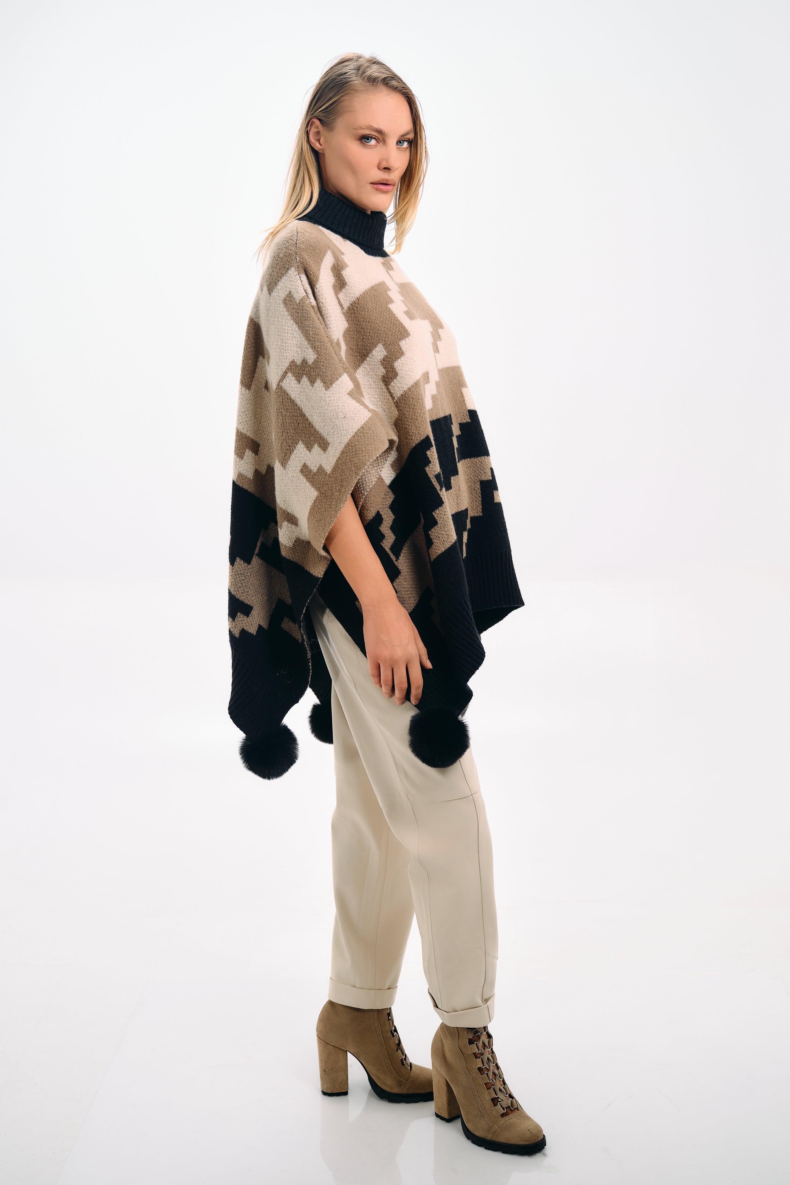 PATTERNED KNIT CAPE WITH POMPONS