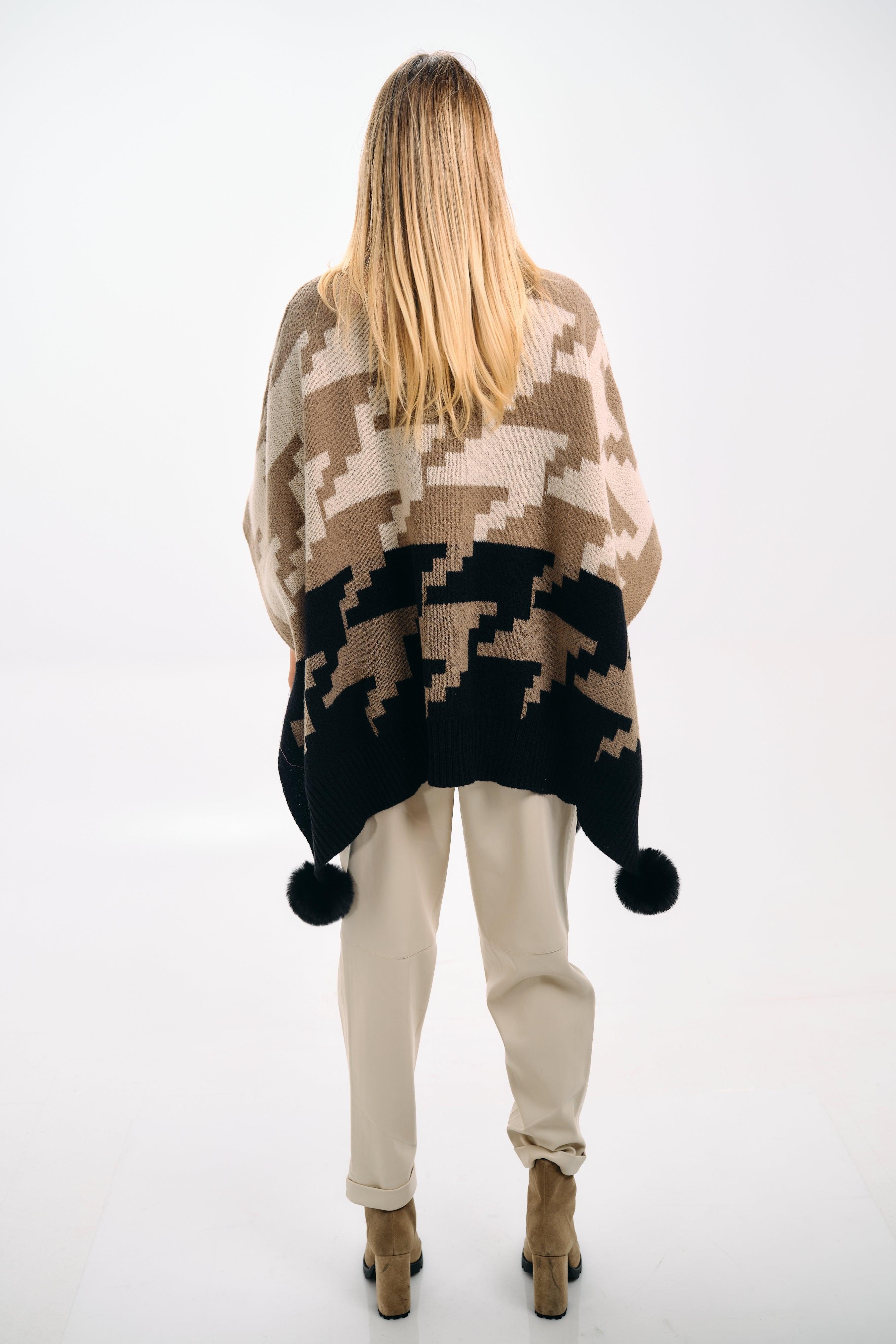 PATTERNED KNIT CAPE WITH POMPONS