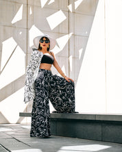 ABSTRACT FACE PRINT WIDE-LEG PANTS