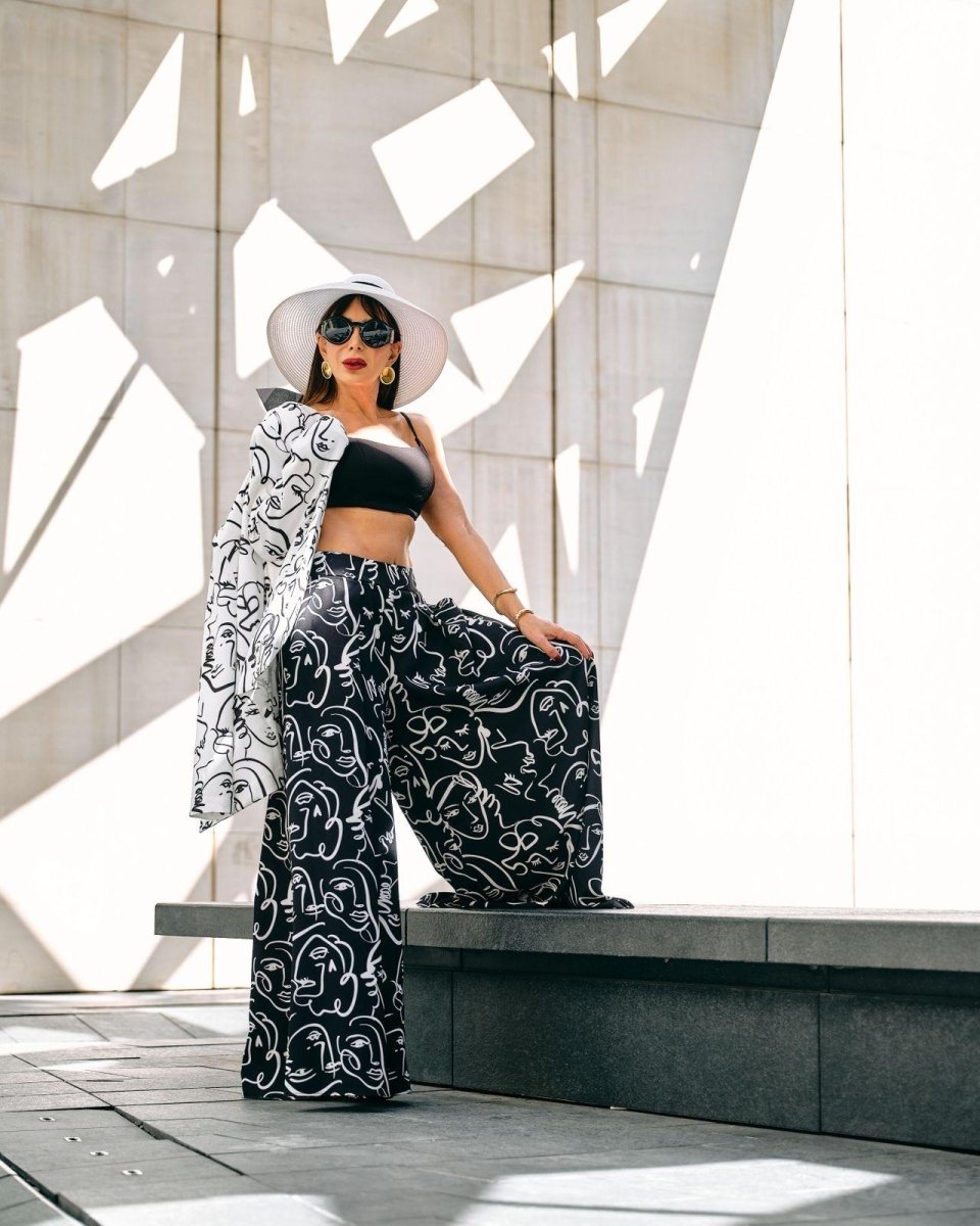 ABSTRACT FACE PRINT WIDE - LEG PANTS 